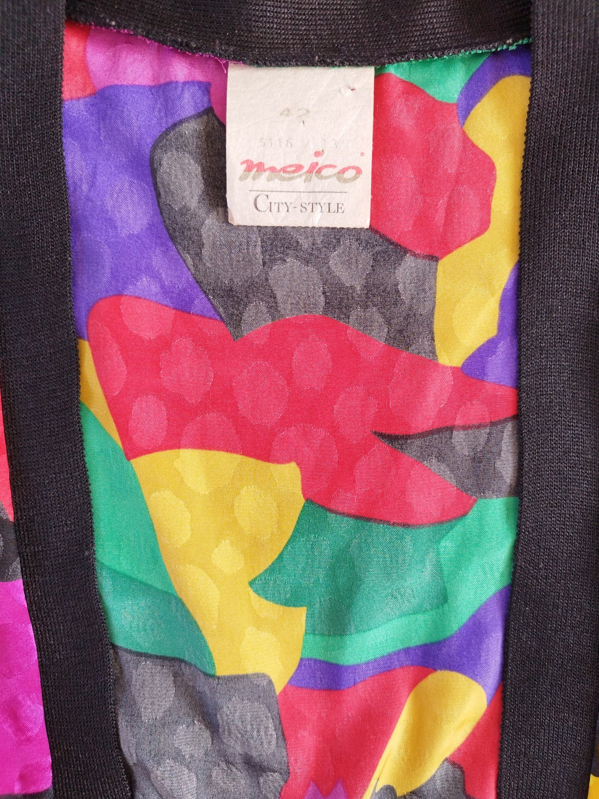 Brightly Colored Jacket with Deep Cleavage and Wide Shoulders