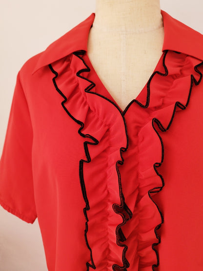 Detail of Bright Red Shirt Featuring Front Ruffle