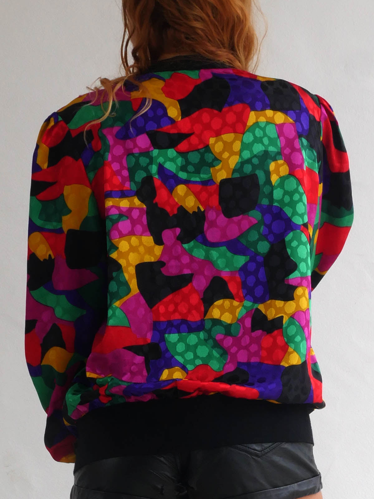 Back of Brightly Colored Jacket with Deep Cleavage and Wide Shoulders